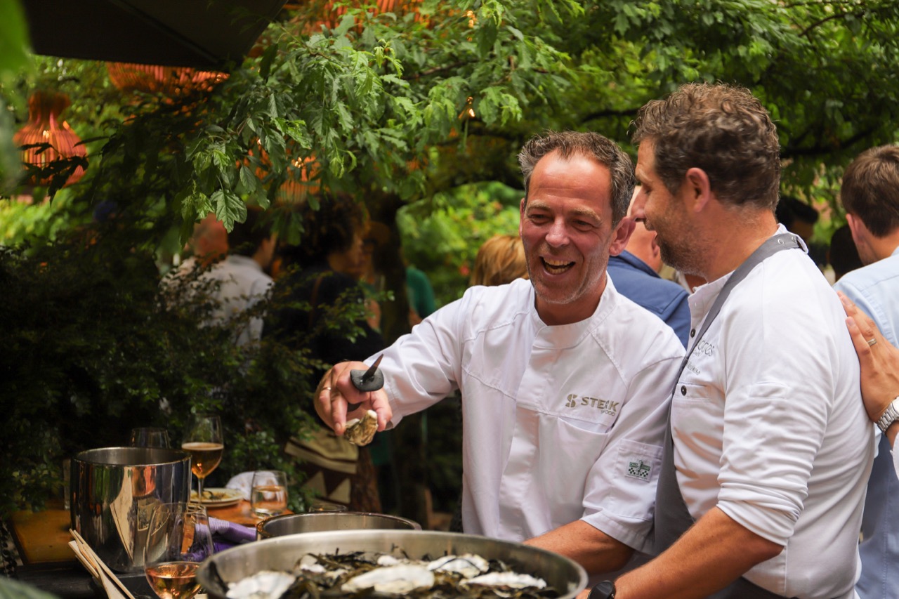 Chefs shucking oysters at the garden party
