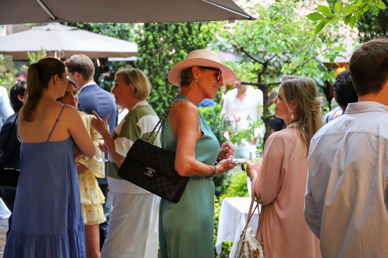 Guests mingling at the Sofitel garden party