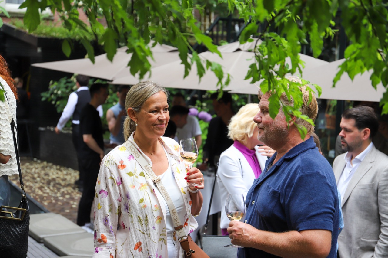 Guests in conversation at the garden party