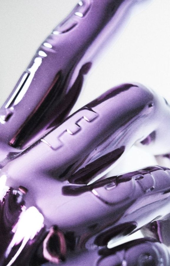 Close-up of Vliegwork's Five Finger Scrapbook sculpture in metallic chrome
